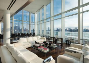 This office area with large multi-tiered panes shows how much glare there could potentially have been if the glass had not been treated to reduce the glare and heat allowing occupants to comfortably work without eye strain or overheating.